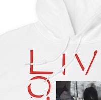 a white hoodie with an image of a man and a woman