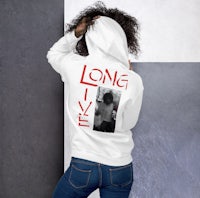 a woman wearing a long live hoodie